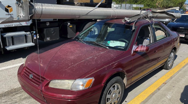 Utility Pole Strapped To Car