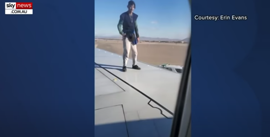 Man on Wing of Plane