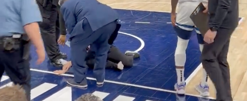 Protester Glues Herself to Basketball Court