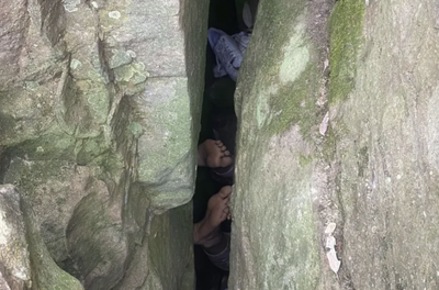 Woman Stuck In Rocks