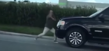 Man Punching Car